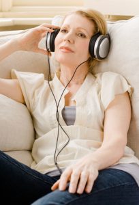 Woman listening to headphones